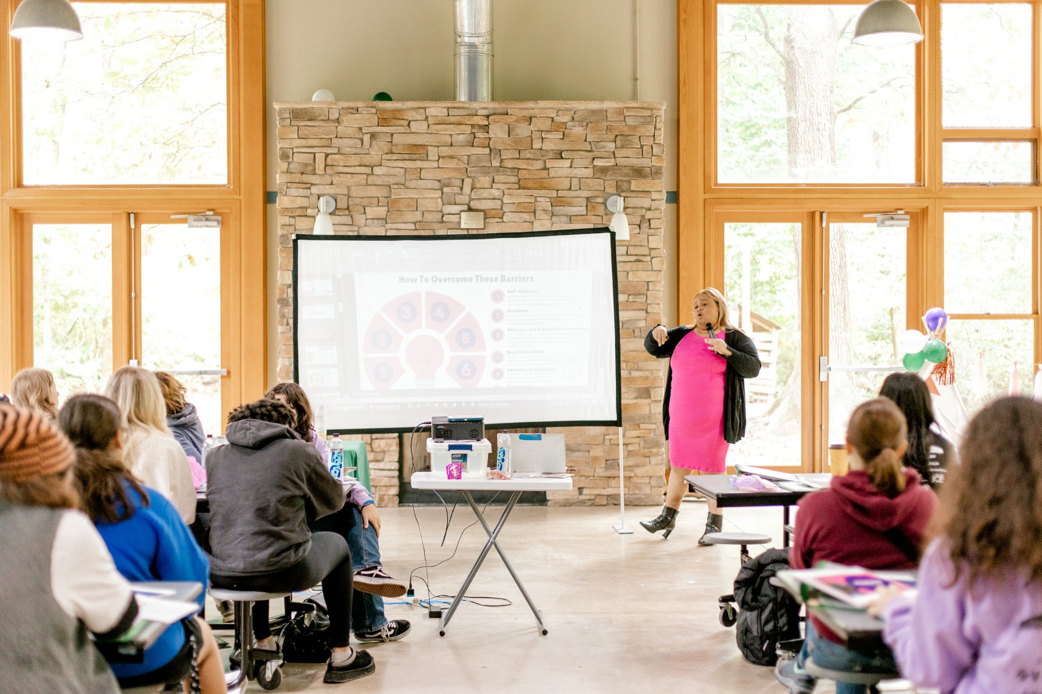Yasha Sterling speaking to a live audience